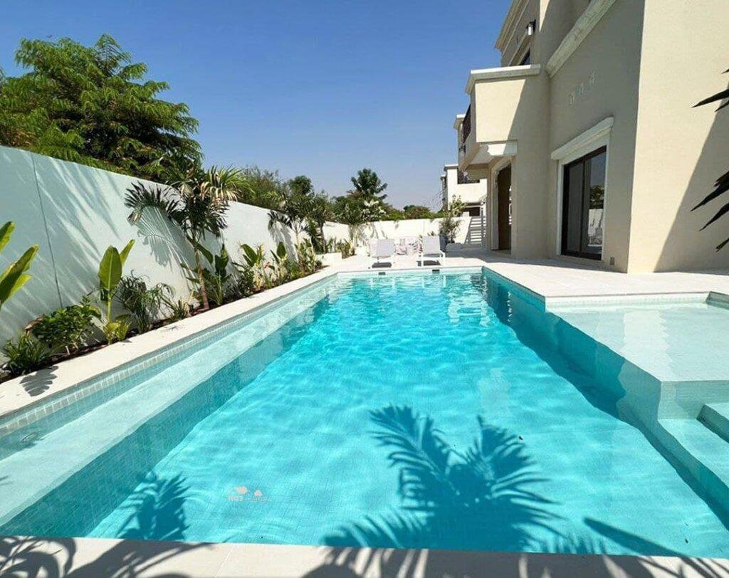 Luxury swimming pool construction with Spanish mosaic tiles in Dubai villa
